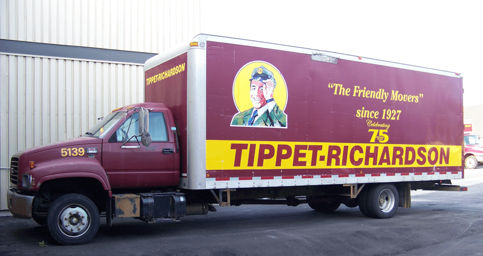 Red color Tippet-Richardson moving truck parked in front of a storage facility